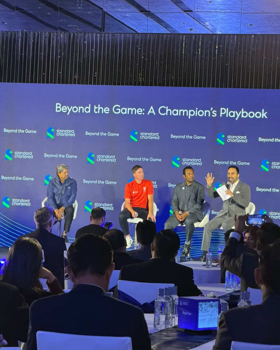 Arpit Sharma moderating the Standard Chartered Beyond the Game panel with Kapil Dev, Robbie Fowler and Leander Paes